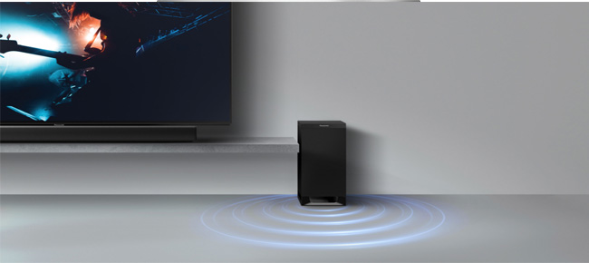 Subwoofer neben einem Fernseher mit Soundbar