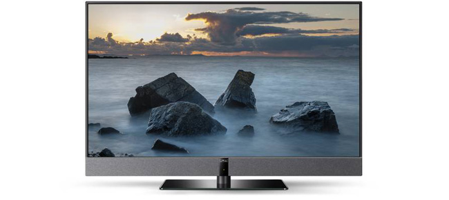 Flachbildfernseher mit angezeigtem Bild von Felsen im Meer bei Sonnenuntergang